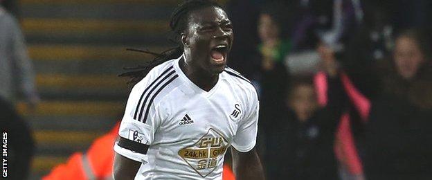 Bafetimbi Gomis celebrates a goal for Swansea