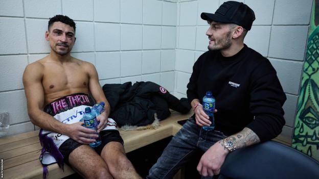 Jordan Gill (L) and Leigh Wood backstage after Gill's fight