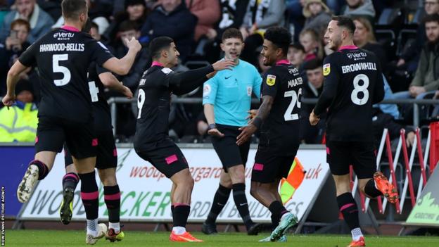 Ian Maatsen celebrates with his team-mates after putting Burnley ahead