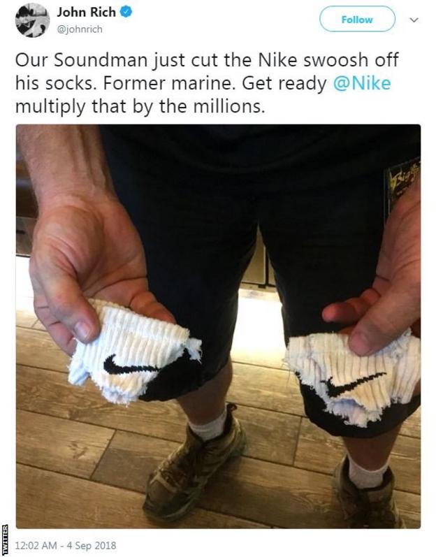 John Rich tweet in which he shows a picture of a pair of destroyed Nike socks