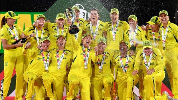 Australia celebrate beating England to win the Women's World Cup in April 2022