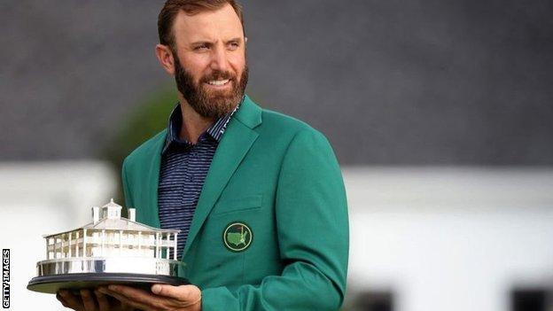 Dustin Johnson in Green Jacket with Masters trophy