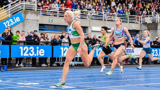 Sarah Lavin crosses the finishing line to win the 100m in a lifetime best