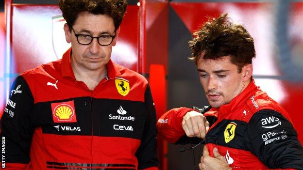 Ferrari team principal Mattia Binotto and Charles Leclerc