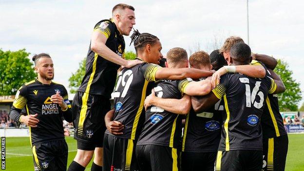 Sutton players celebrate