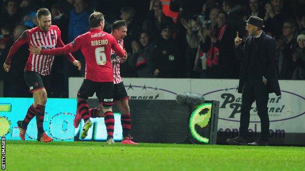 Paul Tisdale reacts to Lee Holmes after he put Exeter 2-1 up against Liverpool at St James Park