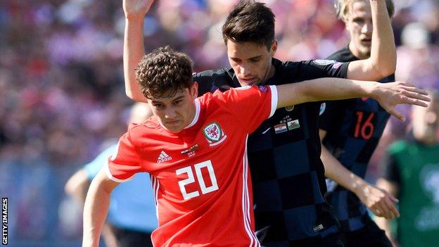 Wales wing Daniel James holds off Croatia defender Josip Brekalo