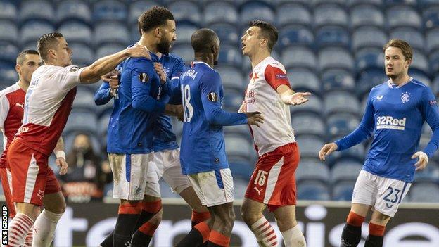 Connor Goldson had to be held back as he charged after Ondrej Kudela