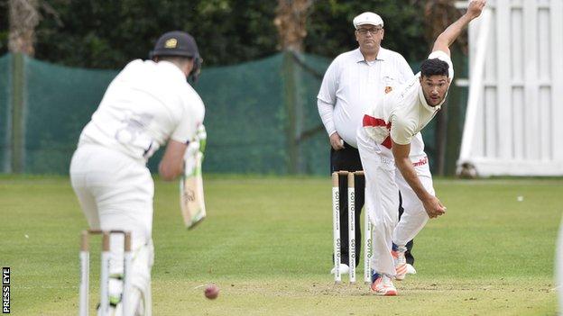 Waringstown bowler Shaheem Khan sends down a delivery in Saturday's league win over Instonians