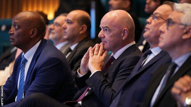 Patrice Motsepe (left), Gianni Infantino (centre) and Faouzi Lekjaa (second from right)