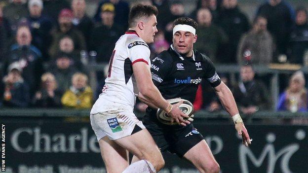 Ulster's Jacob Stockdale with Ospreys' Kieron Fonotia