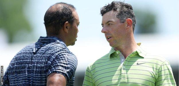 Tiger Woods congratulates Rory McIlroy after their opening round at Southern Hills