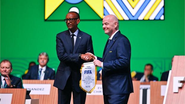 President of Rwanda Paul Kagame (left) and FIFA President Gianni Infantino (right) exhange gifts during the 73rd FIFA Congress on March 16, 2023 in Kigali, Rwanda.