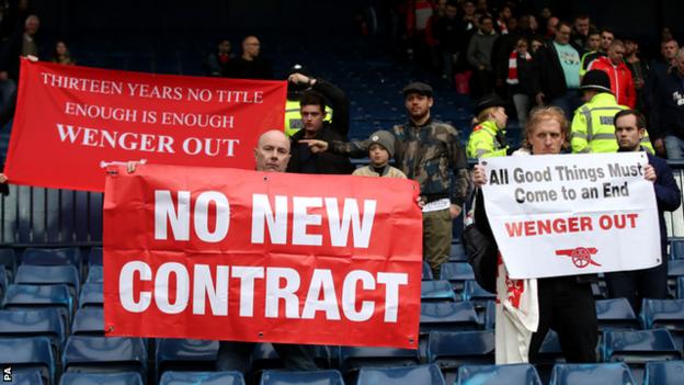 Arsenal fans who want Arsene Wenger to leave held up banners during their team's 3-1 defeat at West Brom last Saturday