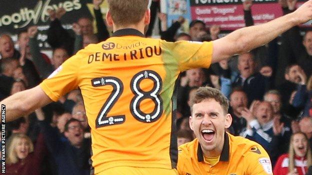 Newport scorer Mickey Demetriou spins away to celebrate with man of the match Mark Randall