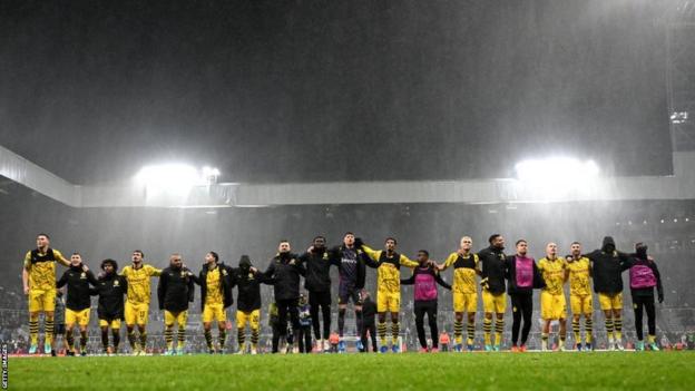 Borussia Dortmund players line up after the game