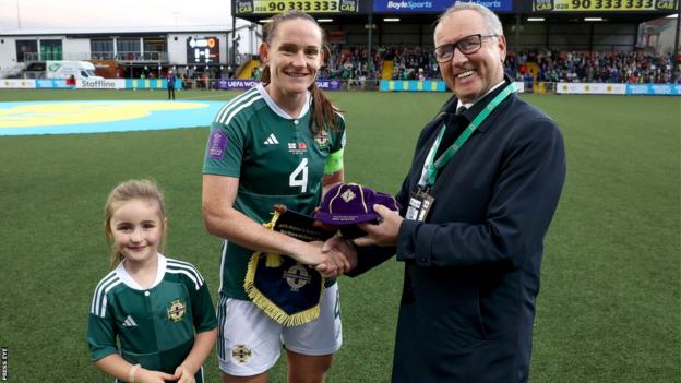 Sarah McFadden, with her daugher Harper by her side, was presented with her 100th cap before kick-off