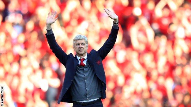 Arsene Wenger waves to the supporters when he was Arsenal manager