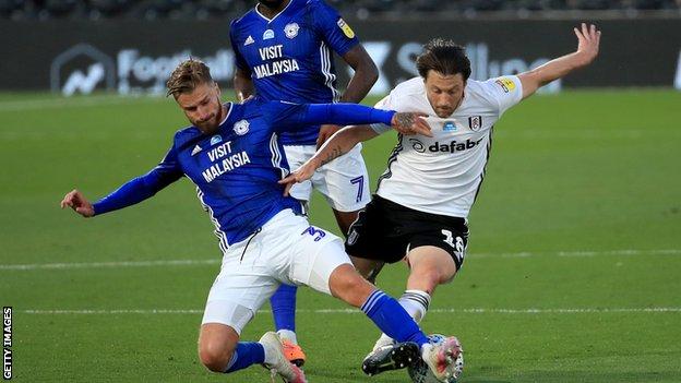 Cardiff and Fulham players challenge for the ball - Joe Bennett and Harry Arter