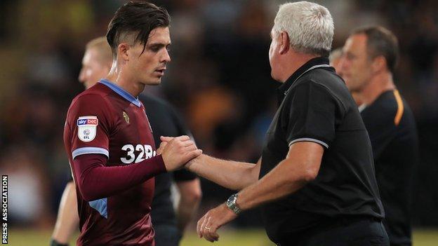 Jack Grealish shakes Steve Bruce's hand as he is substituted late on at Hull