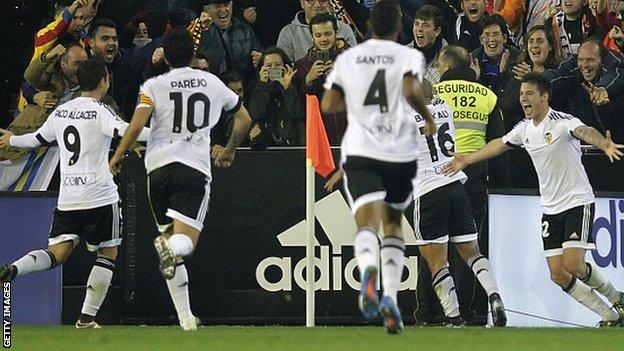 Valencia's players celebrate equalising against Barcelona