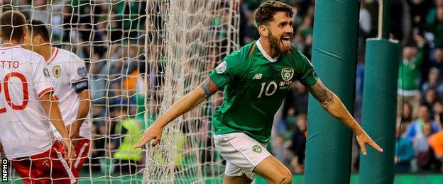 Robbie Brady wheels away in celebration after scoring Ireland's second goal