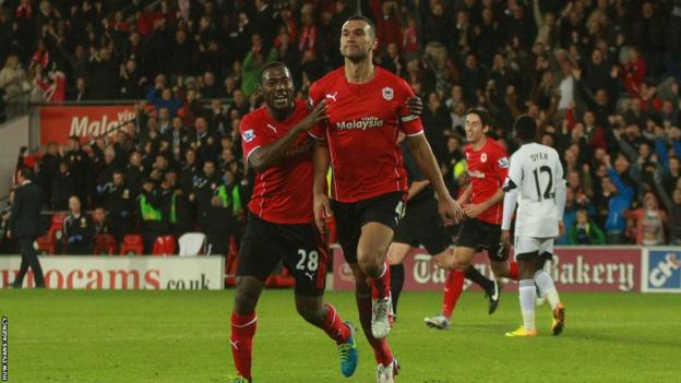 Steven Caulker celebrates scoring against Swansea in 2013