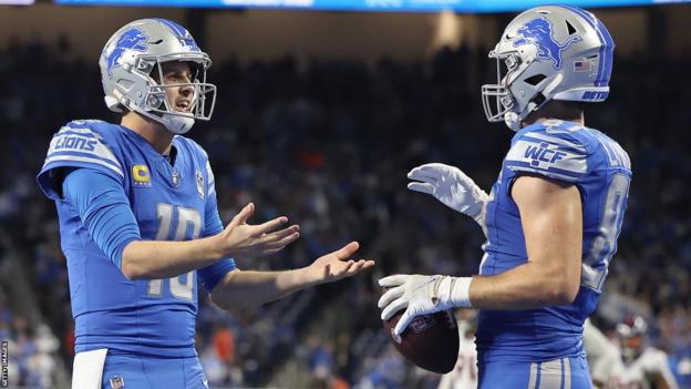 Detroit's Sam LaPorta and Jared Goff celebrate a touchdown against the Denver Broncos