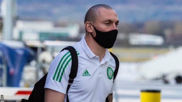 Celtic captain Scott Brown at Glasgow Airport