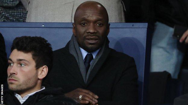 Claude Makelele watches a game from the stands