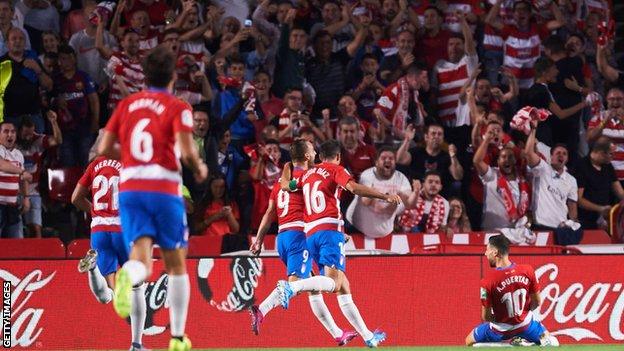 Granada celebrate scoring against Barcelona