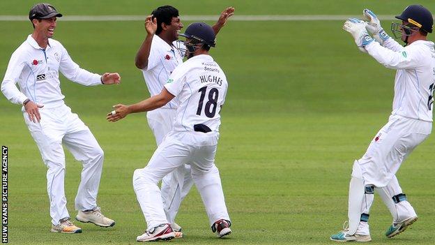Jeevan Mendis of Derbyshire celebrates with Alex Hughes and team mates after Colin Ingram of Glamorgan is caught by Gary Wilson