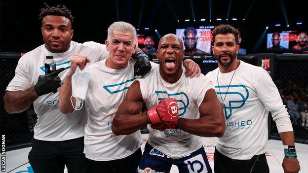 Linton Vassell celebrates his Bellator 277 victory with his team