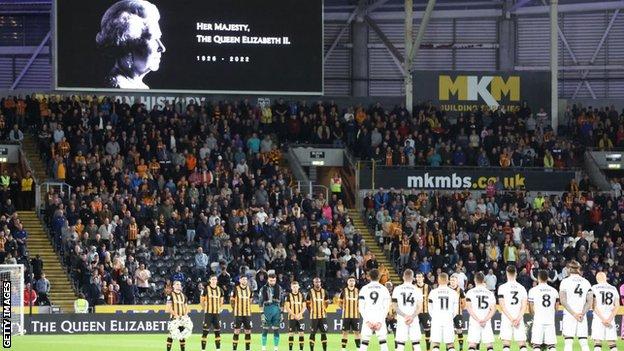 Hull City and Stoke City players observe a minute's silence after the death of Queen Elizabeth II