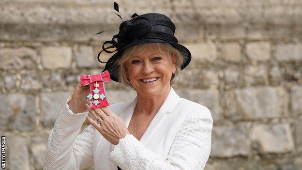 Sue Barker poses with her CBE medal