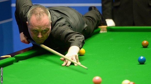 John Higgins plays a pot during his win over Ryan Day