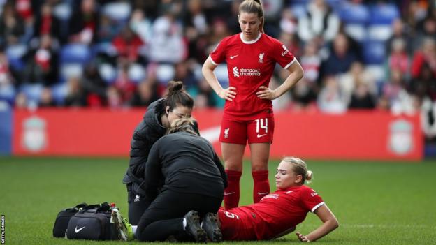 Liverpool's Sofie Lundgaard receives treatment