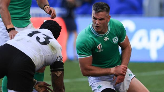 Ireland’s Jonathan Sexton reacts to Jason Tomane of Romania after scoring a try