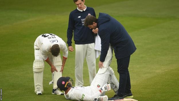 Keaton Jennings receives treatment in Lancashire's game at Somerset