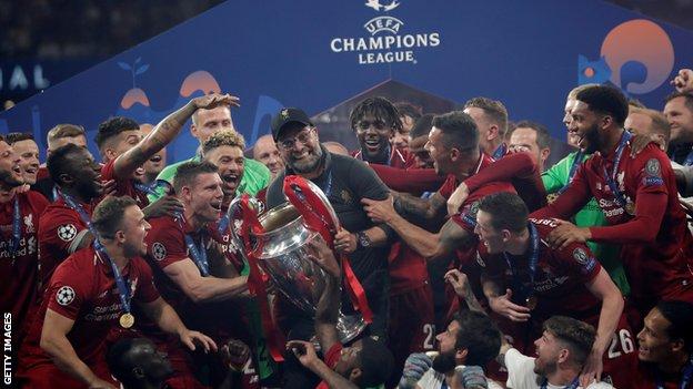 Liverpool with Champions League trophy