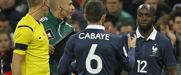 Lassana Diarra is applauded by the Wembley crowd