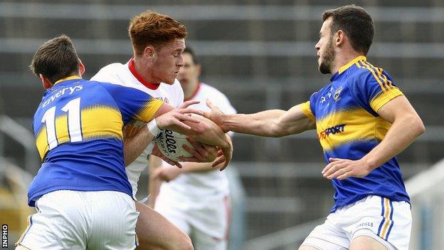 Tyrone's Conor Meyler is tackled by Tipperary's Conor Sweeney in Thurles
