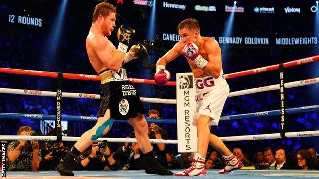 Saul 'Canelo' Alvarez and Gennady Golovkin trade blows in the ring