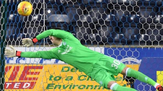 Woodman saves three shoot-out penalties in Aberdeen cup victory - BBC Sport
