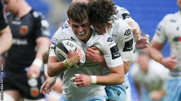 Glasgow fly-half Ross Thompson celebrates a try against Dragons with Rory Darge