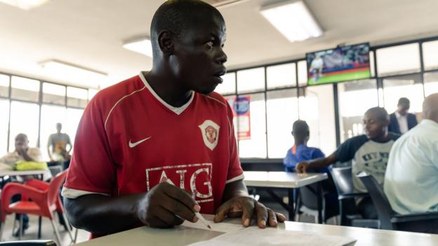 Man placing bet in Zimbabwe