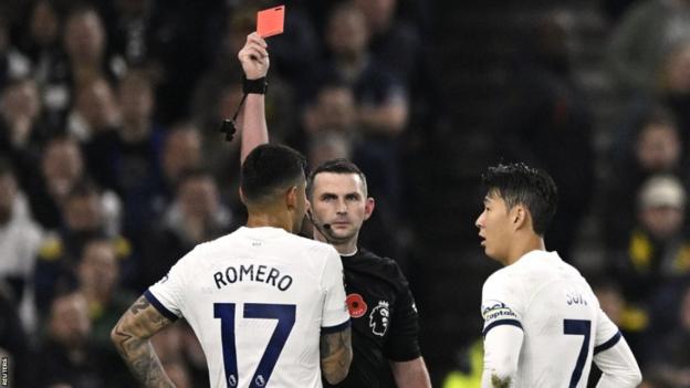 Cristian Romero of Tottenham is sent off by Michael Oliver against Chelsea