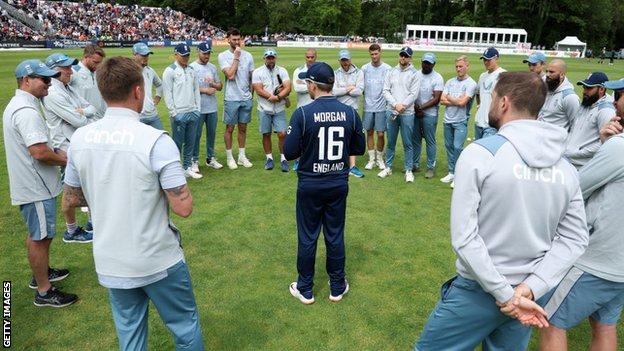 Eoin Morgan addresses his England team as they stand in a circle around him