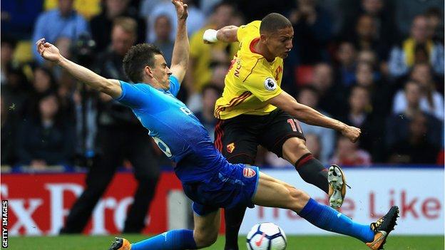 Arsenal defender Laurent Koscielny tries to block a shot from Watford's Richarlison (right)
