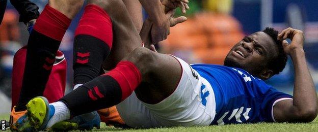 Lassana Coulibaly lies in pain after suffering a late injury